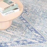 Close-up of the Byers Handmade Cotton-blend Aqua Rug showing its bohemian, traditional pattern and texture. Aqua, blue, and green tones. Styleshot