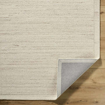 Close-up of the Blenda Tan Area Rug showing its beige, cream, and tan wool texture and hand-tufted construction. Fold