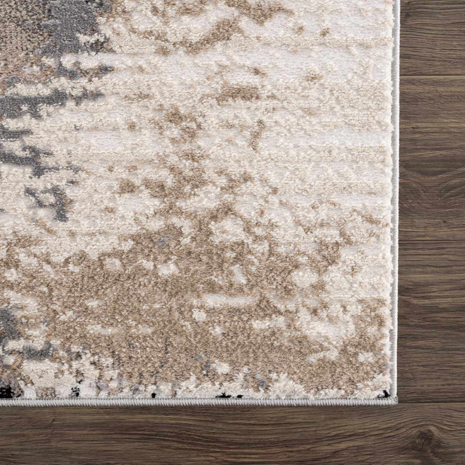 Close-up of the Birdie Area Rug showing ash, light silver, sage, and silver gray tones with a contemporary abstract design. Swatch