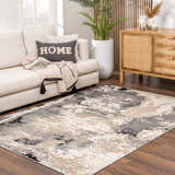 Living room scene with a contemporary ash, silver gray Birdie Area Rug, cream sofa, and wood cabinet. Roomscene-Rectangle