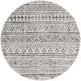 Close-up of a round Catrine Indoor & Outdoor Rug. Black, charcoal, and off-white bohemian geometric pattern. Design-Round-53