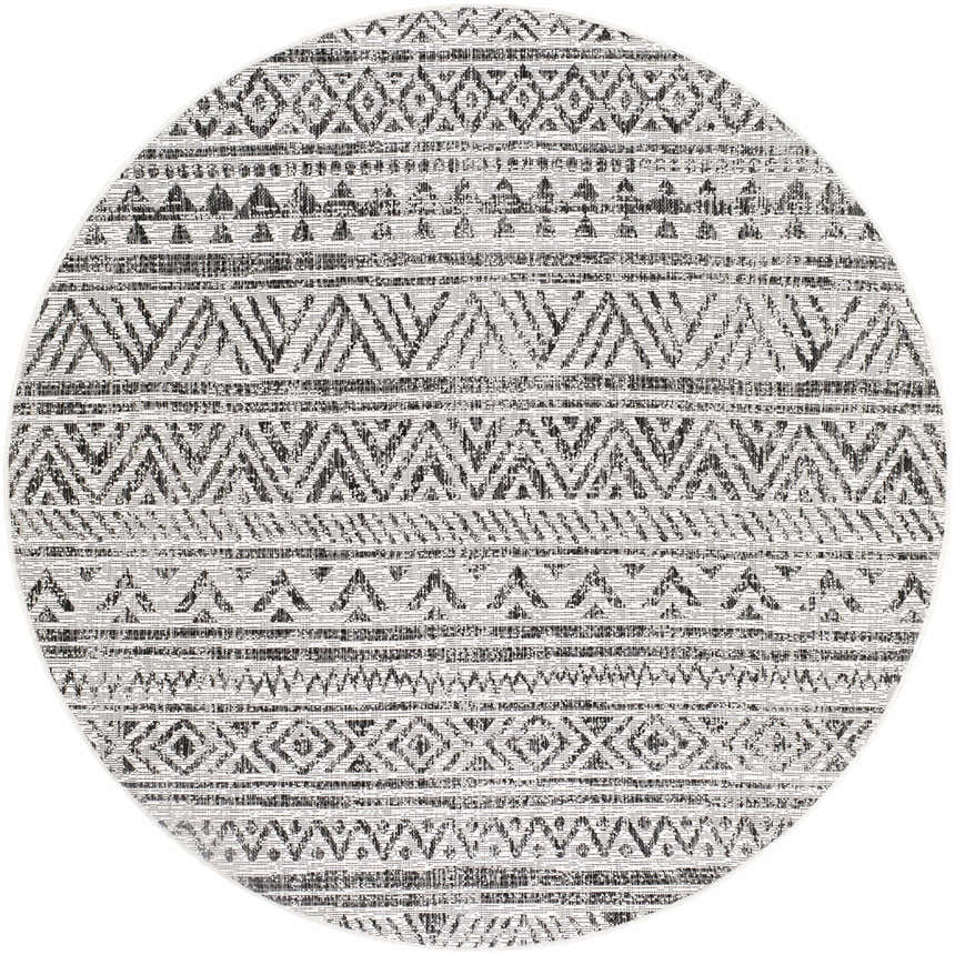 Close-up of a round Catrine Indoor & Outdoor Rug. Black, charcoal, and off-white bohemian geometric pattern. Design-Round-53