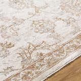 Close-up of the Chyron Cream Area Rug showing its traditional light brown and cream floral pattern and soft texture. Texture