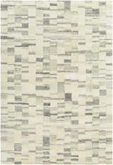 Close-up of the Max Handmade Becki Owens x LIVABLISS rug. Hand-tufted wool rug in blue, charcoal, dove gray, and ivory. Contemporary style. Design-Rectangle-576
