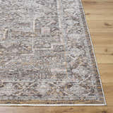 Close-up of the Clovia Area Rug showing its traditional pattern and colors: black, gray, ivory, medium brown, and taupe. Front
