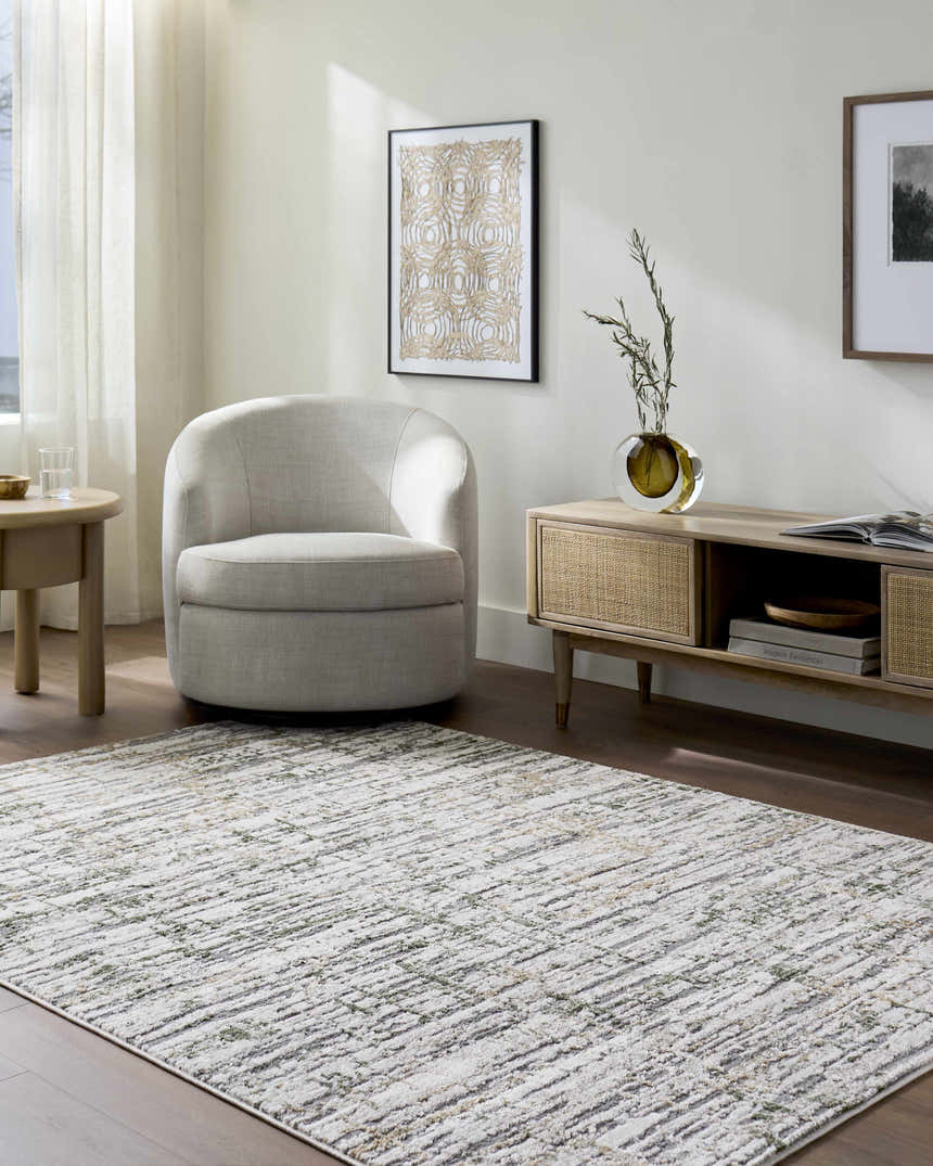 Living room scene with beige Amoura Area Rug, light gray chair, and wood furniture. Contemporary style. Roomscene-Rectangle