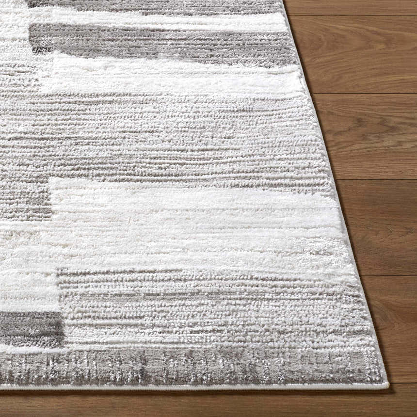 Close up of the Ananya Area Rug featuring ivory, light brown, and gray horizontal stripes. Front
