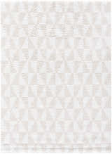 Close-up of the Ceylan Area Rug; a shag rug in medium gray and white with a subtle geometric pattern. Design-Rectangle-537