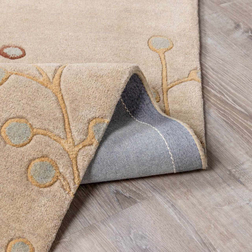 Close-up of the Elsu Beige&Gray Wool Rug showing floral design, soft texture, and durable backing. Fold