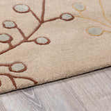 Close-up of the Elsu Beige&Gray Wool Rug showing the floral design, brown stems, and beige wool texture. Pile