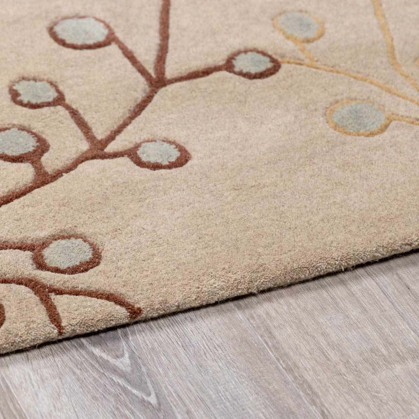 Close-up of the Elsu Beige&Gray Wool Rug showing the floral design, brown stems, and beige wool texture. Pile
