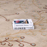 Close-up of the Elsu Beige&Gray Wool Rug, showcasing its floral design, tan branches, and gray accents. Styleshot