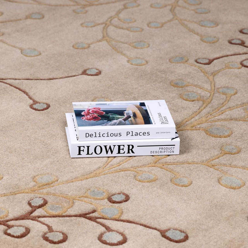 Close-up of the Elsu Beige&Gray Wool Rug, showcasing its floral design, tan branches, and gray accents. Styleshot