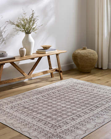 Entryway with Rainier Light Brown Washable Rug, wood bench with vases, and woven basket for a farmhouse feel. Roomscene-Rectangle