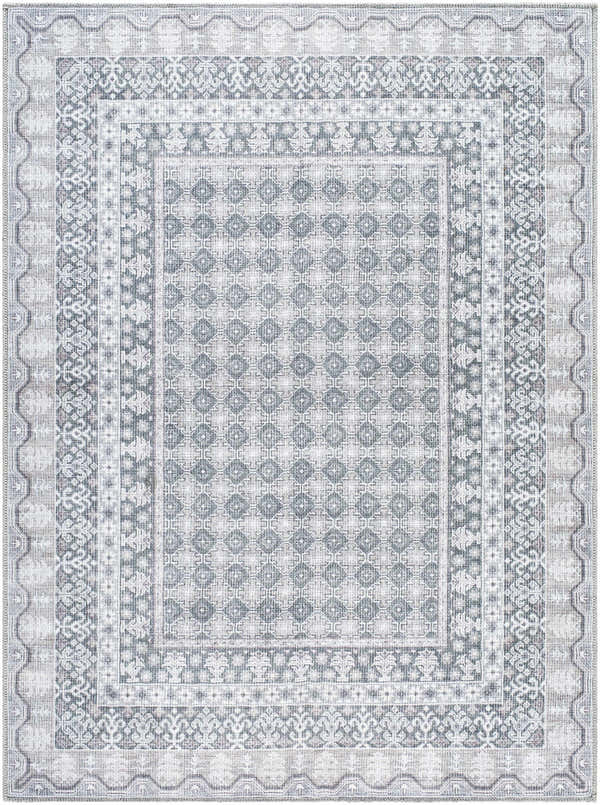 Close-up of the Rainier Gray Washable Rug. Farmhouse style rug features a traditional geometric pattern in off white, pale blue, and sage. Design-Rectangle-5373