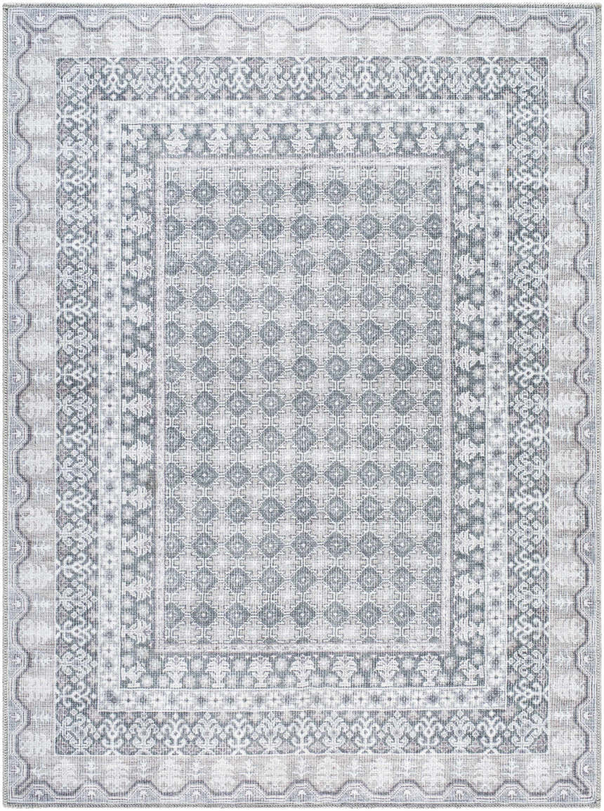 Close-up of the Rainier Gray Washable Rug. Farmhouse style rug features a traditional geometric pattern in off white, pale blue, and sage. Design-Rectangle-5373