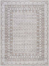 Close-up of the Rainier Brown Washable Rug with a traditional, geometric pattern in brown, gray, and sage hues. Design-Rectangle-5373
