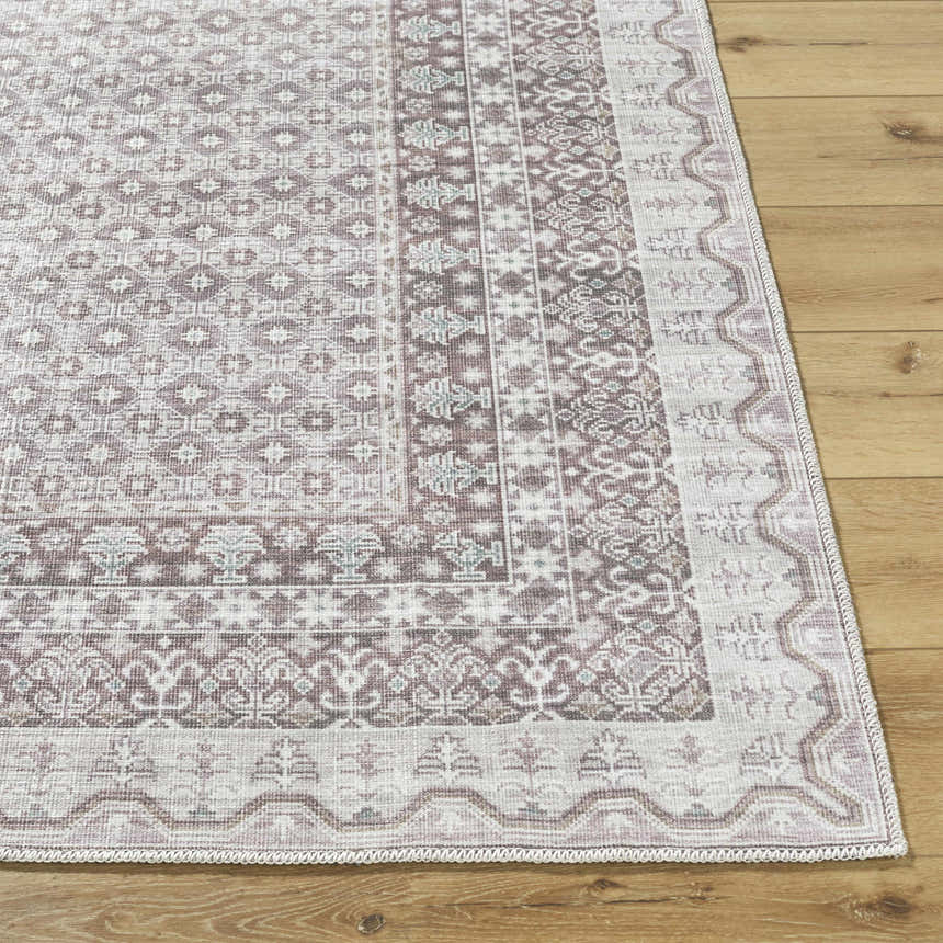 Close-up of the Rainier Brown Washable Rug showing its traditional brown, gray, and sage pattern and machine-woven texture. Front