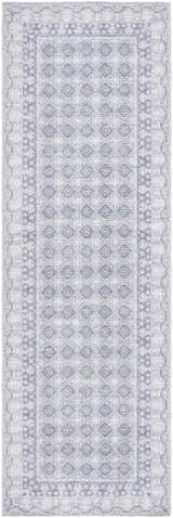 Close-up of the Rainier Blue Washable Rug. Features a pale blue geometric pattern and traditional border design. Design-Runner-27710