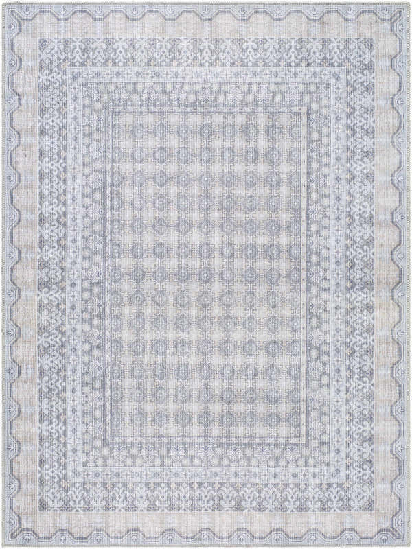 Close-up of Rainier Blue Washable Rug. Farmhouse style rug with pale blue, white, and gray traditional pattern. Design-Rectangle-5373