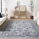 Living room with white sofas and Michie Blue Area Rug. The rug has a traditional blue and white pattern. Roomscene-Rectangle