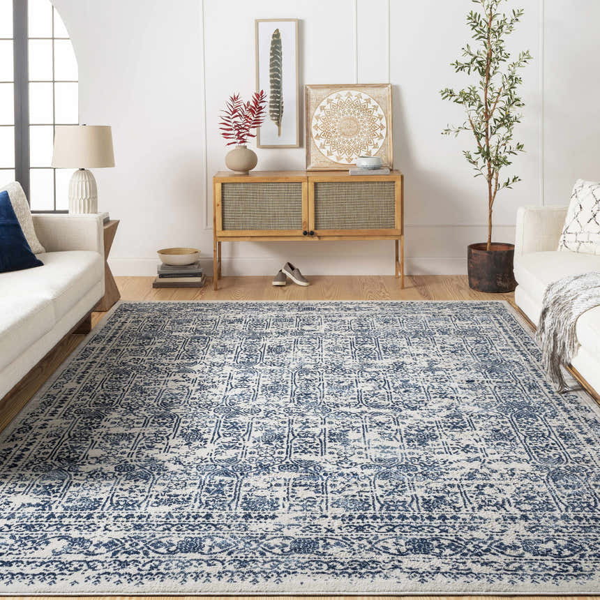 Living room with white sofas and Michie Blue Area Rug. The rug has a traditional blue and white pattern. Roomscene-Rectangle