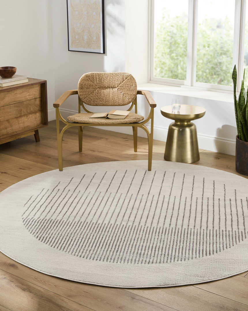 Living room scene with a round Chet Area Rug in cloud gray with a geometric design. Roomscene-Round