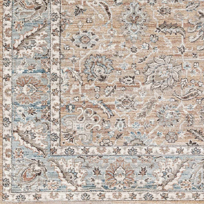 Close-up of the Civankan Area Rug. Machine-woven polyester rug in brick red, denim, and light gray with a traditional oriental pattern. Swatch
