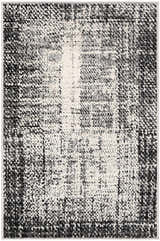 Close-up of the Colson Gray Area Rug showcasing its light silver, onyx, and silver gray contemporary design. Design-Rectangle-23