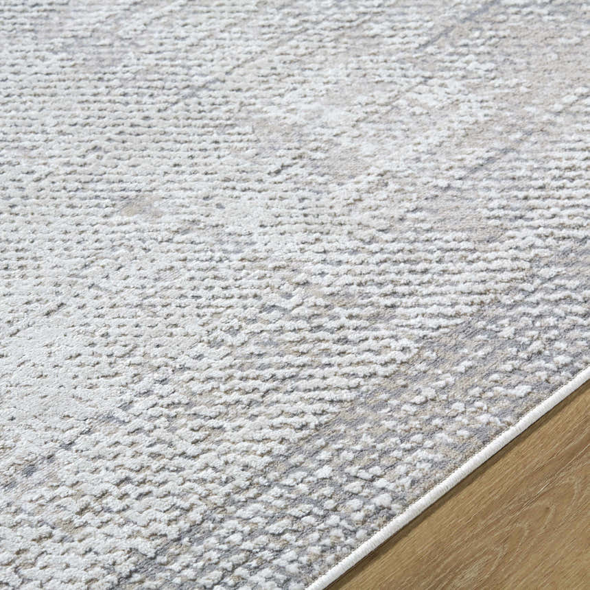Close-up of Colson Sage Area Rug showing its ash, pale pink, and silver gray contemporary design. Texture