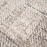 Close-up of the Colson Sage Area Rug showing its textured, machine-woven design in ash, silver gray, and pale pink. Texture
