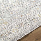 Close-up of the machine woven Xiye Silver Medallion rug, showing its texture and farmhouse style pattern. Texture