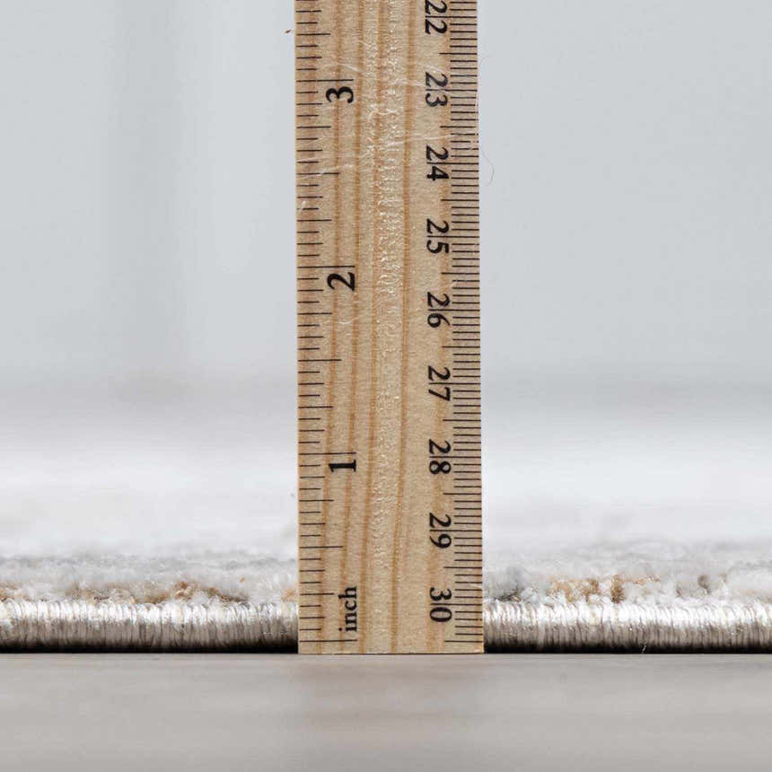 Close-up of the thick pile height of the Claydon Luxe Oushak Rug, showing its plush texture and durable machine-woven construction. Pile