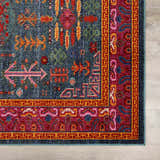 Close-up of the Cleveland Colorful Traditional Area Rug with teal, red, yellow, and aqua hues. Features a vintage-inspired pattern. Swatch
