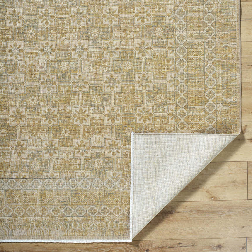 Close-up of Becki Tan Owens x Livabliss Renaissance Area Rug showing beige, tan, and taupe traditional pattern. Fold