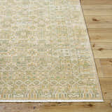 Close-up of the Becki Owens x Livabliss Renaissance BORI-2304 rug. Beige, olive, tan, and taupe tones create a traditional pattern. Front