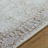 Close-up of the Clodia Area Rug showing its charcoal, ivory, and taupe traditional pattern and hand-tufted texture. Texture