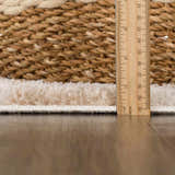 Close up of the pile height of the Canika Checkered Cream Washable Area Rug, next to a ruler. Pile