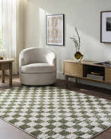 Living room scene with a Canika Green Checkered Washable Plush Rug, neutral chair, wood media console, and light wood floors. Roomscene-Rectangle