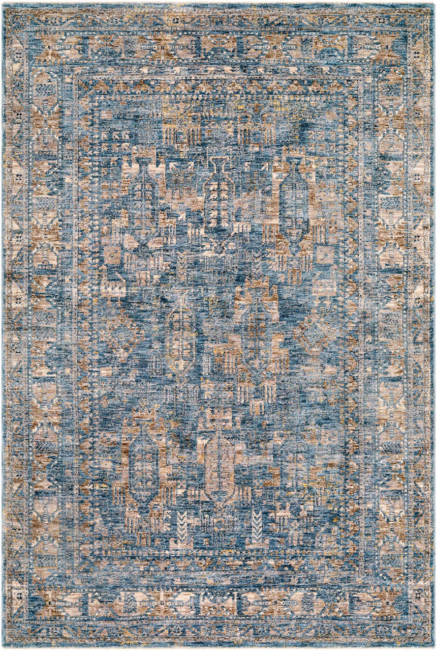 Close-up of the Mirabel Denim Blue Traditional Rug. Features cream, blue, brown, and gray tones in a bohemian pattern. Design-Rectangle-537