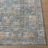 Close up of the Mirabel Denim Blue Traditional Rug showing the texture and pattern. Front