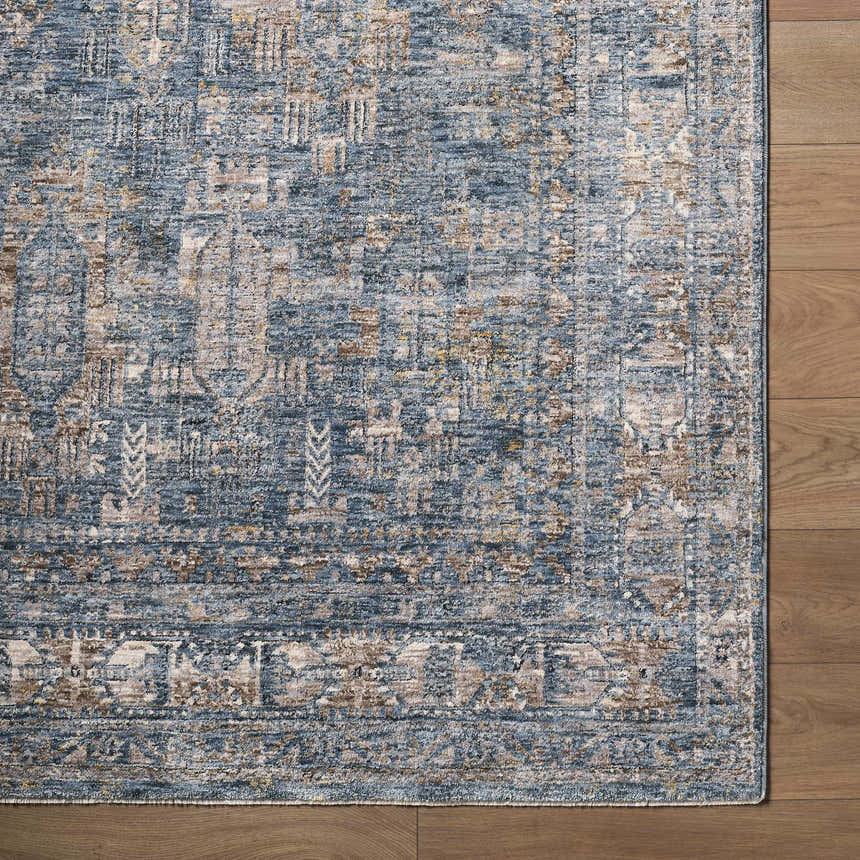 Close-up of Mirabel Denim Blue Traditional Rug showing its cream, blue, and brown oriental pattern and soft texture. Corner