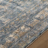 Close-up of Mirabel Denim Blue Traditional Rug showing cream, blue, brown, and mustard colors and soft texture. Texture