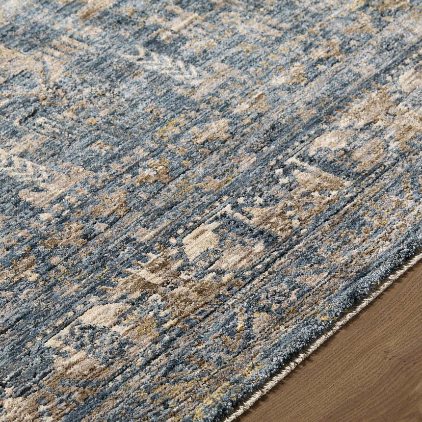 Close-up of Mirabel Denim Blue Traditional Rug showing cream, blue, brown, and mustard colors and soft texture. Texture