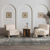 Living room scene with two chairs and Mirabel Denim Blue Traditional Rug. Arched doorways and neutral tones create a calming mood. Roomscene-Rectangle
