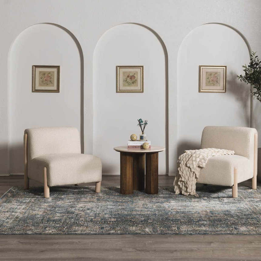 Living room scene with two chairs and Mirabel Denim Blue Traditional Rug. Arched doorways and neutral tones create a calming mood. Roomscene-Rectangle