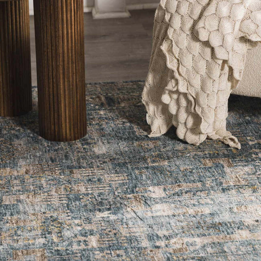 Close up of the Mirabel Denim Blue Traditional Rug showing its texture and colors. Styleshot