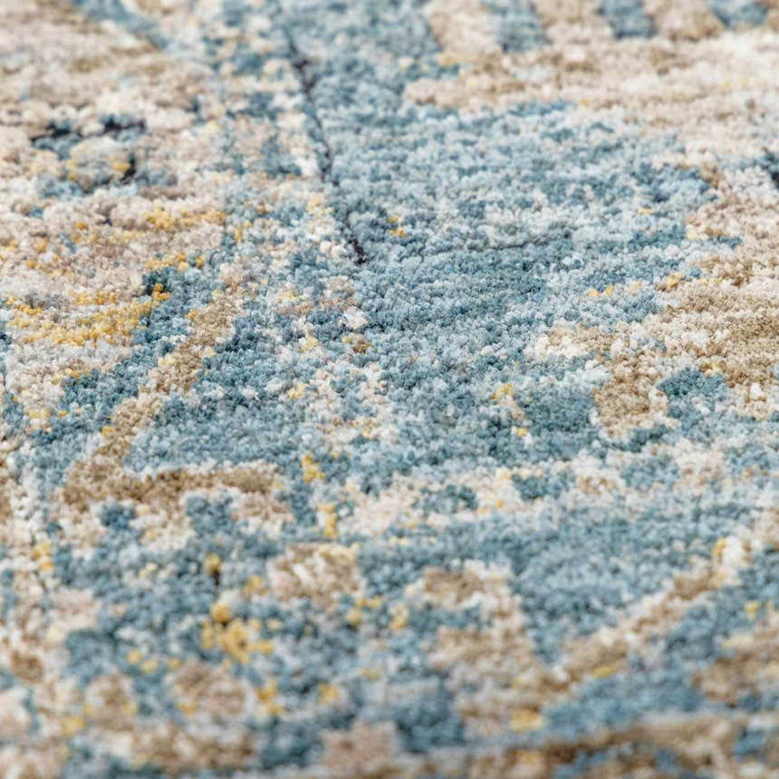 Close-up of the Mirabel Denim Blue Traditional Rug showing its texture and cream, blue, and brown pattern. Texture