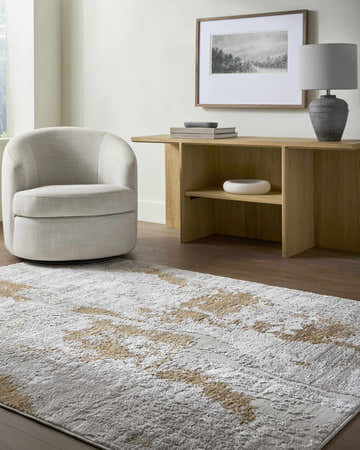 Living room scene with neutral swivel chair and Chroma Area Rug in ivory, light gray, and mustard. Roomscene-Rectangle