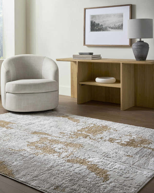 Living room scene with neutral swivel chair and Chroma Area Rug in ivory, light gray, and mustard. Roomscene-Rectangle
